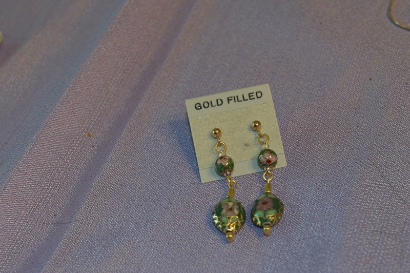gold-filled earrings featuring an oval cloisonne bead with a green background.
