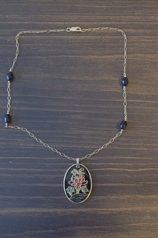 flat cloisonne pendant on gold-filled chain with faceted black onyx bead accents.