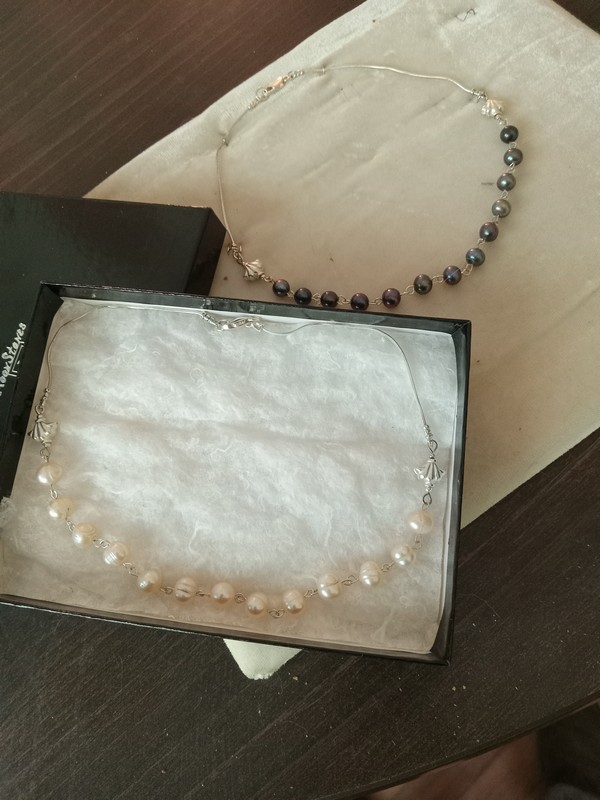 choker length (14 inch)sterling silver and freshwater pearl necklaces, one with dyed peacock pearls and one with natural pink pearls